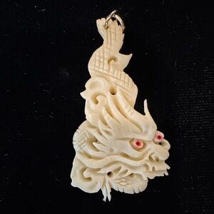 Intricately Carved Celluloid/Faux Ivory Dragon Pendant